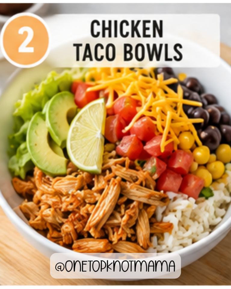 Healthy slow cooker chicken taco bowl with shredded chicken, rice, black beans, corn, avocado, and shredded cheese.
